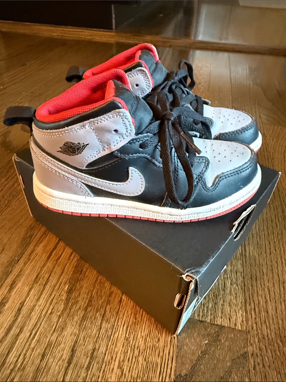 Jordan Black and Gray High-Top Sneakers with Red Lining kids